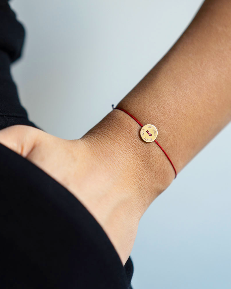 Red Ribbon Bracelet with Medal and Quote